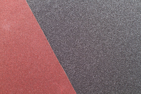 Texture of a black and red sandpaper in a close up viewの写真素材