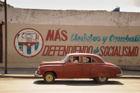 old retro american car driving on street in Cuban capitol city Havanaのeditorial素材