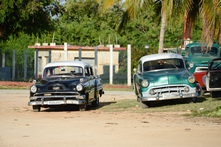 old american car on beach in Trinidad, Cuba December 2013のeditorial素材