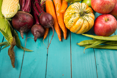 Farm fresh organic vegetables on rustic wooden blue table background
