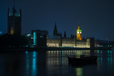 Night view on London landmarks Big Ben Clock and Parliament House over river Thames