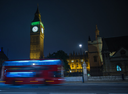 Night view on London landmarks Big Ben Clock and motion blur of double decker red busの写真素材