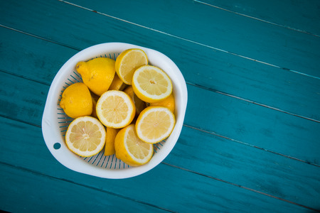 Market fresh organic lemons halves on wooden table background with copy spaceの写真素材