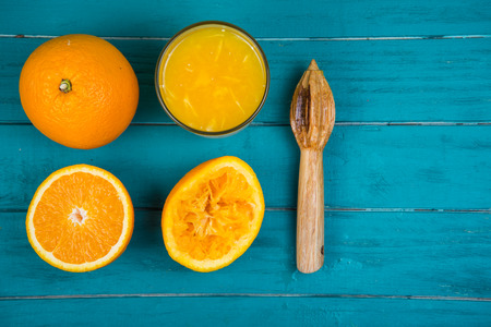 Stages of making fresh organic squeezed juice on wooden rustic table backgroundの写真素材