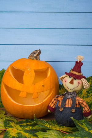 Scarecrow and natural Halloween pumpkinの写真素材