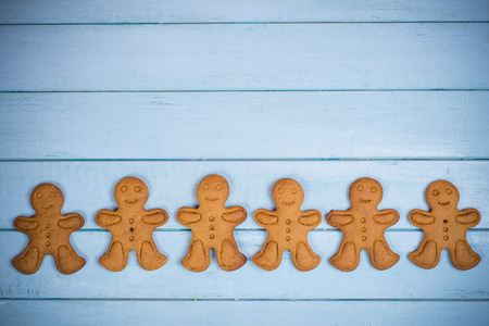 gingerbread man on wooden backgroundの写真素材