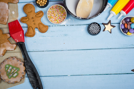 Table view of decorating Christmas gingerbread man cookie