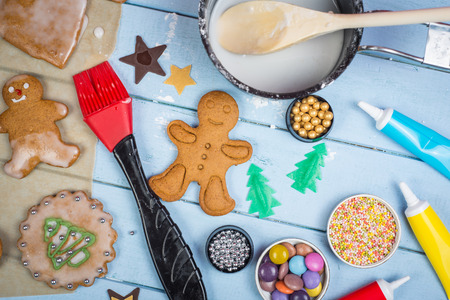 Table view of decorating Christmas gingerbread man cookie