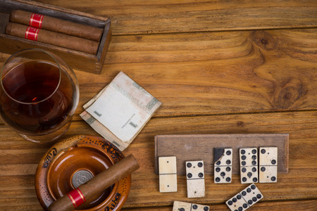 Cuban cigars rum and domino on tableの写真素材