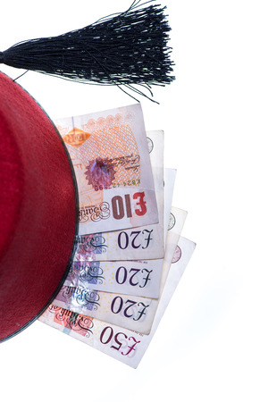 hotel boy hat and money isolated on whiteの写真素材