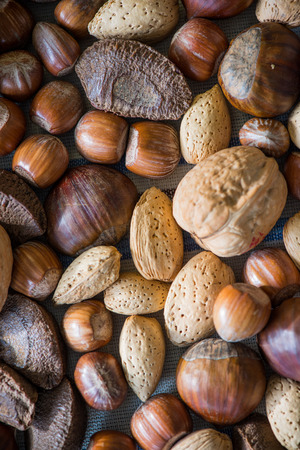top view over mixed nuts backgroundの写真素材