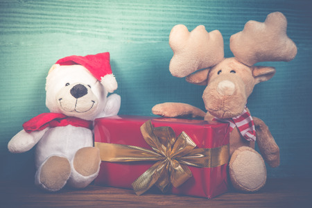 Christmas soft toys in vintage style on blue wooden backgroundの写真素材