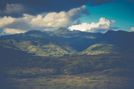 Landscape panorama view on mountains with clouds in vintage effectの写真素材
