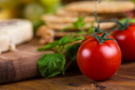 Fresh cherry tomatoes with basilの写真素材