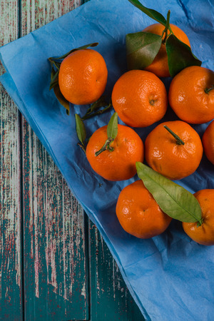 Natural sweet clementines on rustic tableの写真素材