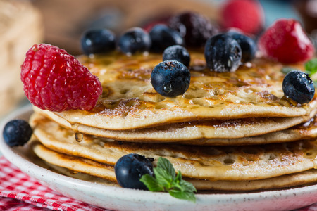 Delicious summer breakfast with fresh berries fruits and sirup