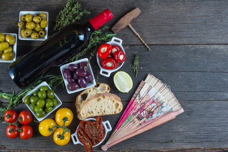 Traditional tapas buffet on wooden table from aboveの写真素材