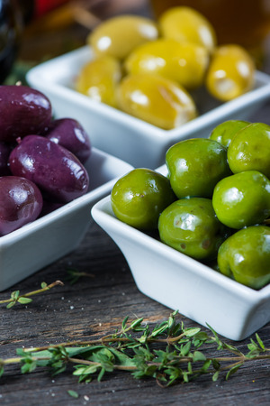 Selection of fresh olives with herbsの写真素材