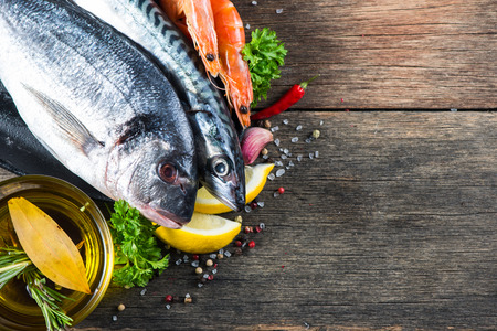 Fresh whole sea fish with aromatic herbs and spices Fresh whole sea fish with aromatic herbs and spices