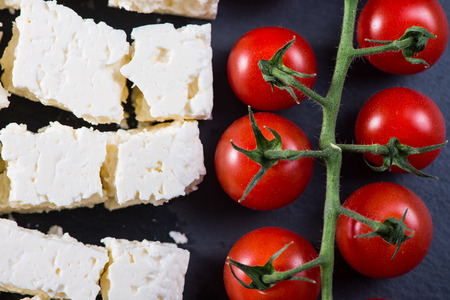 Fresh cheery tomatoes and feta cheeseの写真素材