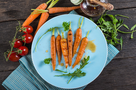 healthy brunch with grilled carrots and honey glazeの写真素材