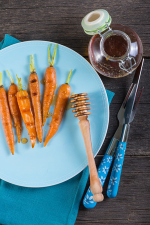 grilled fresh carrots with honey glazeの写真素材