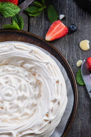 Homemade pavlova meringue with summer fresh berries fruitsの写真素材