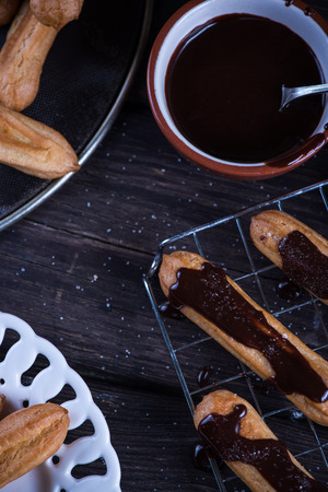 Fresh churro with melting chocolate dip on cooling trayの写真素材