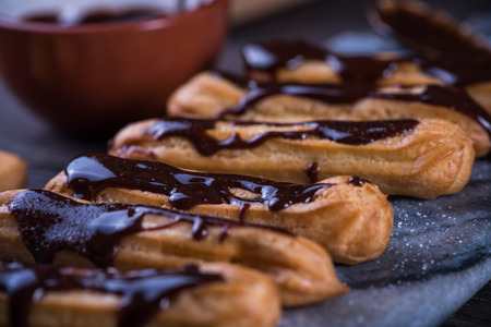 Decorating churros with hot chocolate dip, from aboveの写真素材