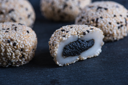 Traditional homemade rice sweet, japanese mochi on black backgroundの写真素材