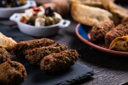 Italian or spanish style snack tapas selection on wooden tableの写真素材