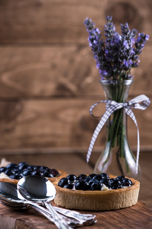 Homemade blueberry tarte served on wooden boardの写真素材