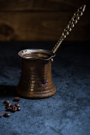 vintage coffee maker and beans on wooden backgroundの写真素材