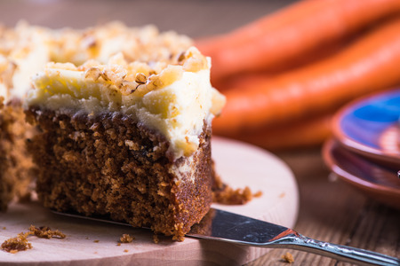 Homemade autumn carrot cake on wooden table