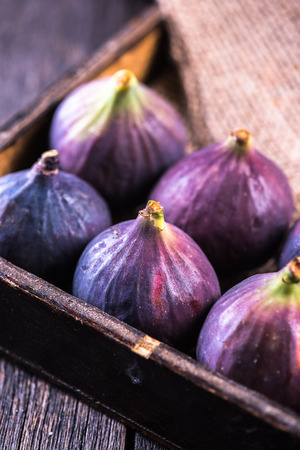 Fresh figs fruit on wooden rustic tableの写真素材