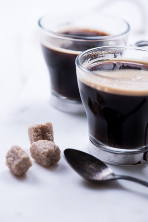 strong shoot of espresso with brown sugar cubesの写真素材