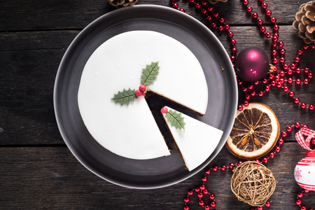 Homemade Christmas fruit cake, on decorated tableの写真素材