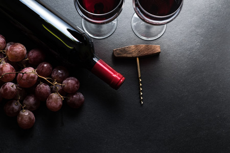 Red wine and grapes
