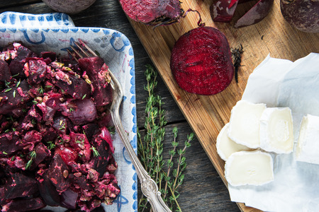 Farmers food, beetroot bake with fresh thyme on wooden tableの写真素材
