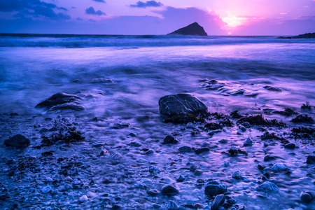 Dramatic sunset at Atlantic ocean in Wembury beach