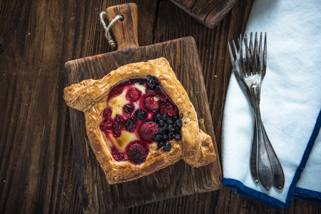 Healthy breakfast,winter berry croissant on rustic wooden tableの写真素材