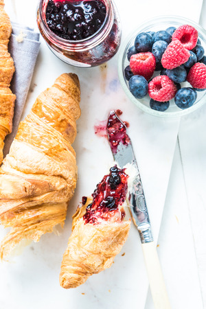 Fresh croissant with berry marmalade,from aboveの写真素材