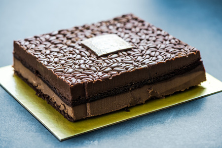 Chocolate and coffee beans cake, on dark slate.の写真素材