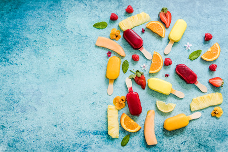 summer natural ice sticks border background, flat lay from overheadの写真素材