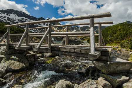 wooden bridge over alpine lake in Tatra mountains at summer time.の写真素材