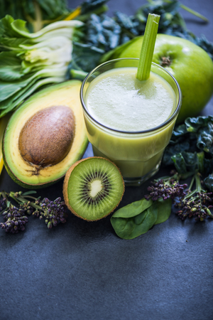 green smoothie ingredients on dark slate backgroundの写真素材