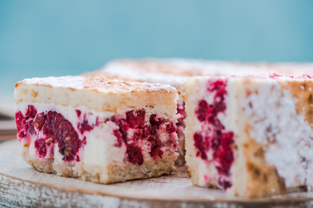 square slice of raspberry semifreddo cake on bright backgroundの写真素材