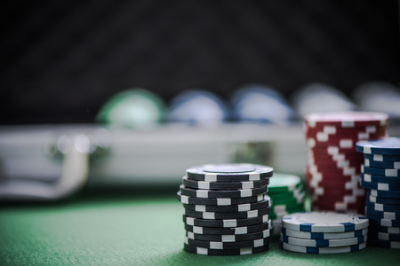 casino chips and metal case, blurred backgroundの写真素材