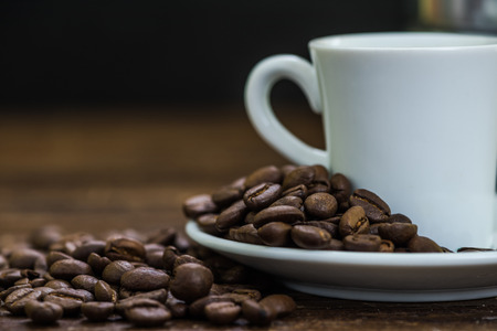 small espresso coffee in cup on wooden table