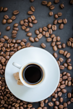 espresso coffee on roasted coffee beans, overhead viewの写真素材